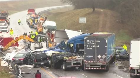 A tow truck works at the scene of a fatal crash that involved four tractor-trailers and two passenger vehicles Friday morning on Interstate 81 north of Hagerstown. At least one person was killed ...